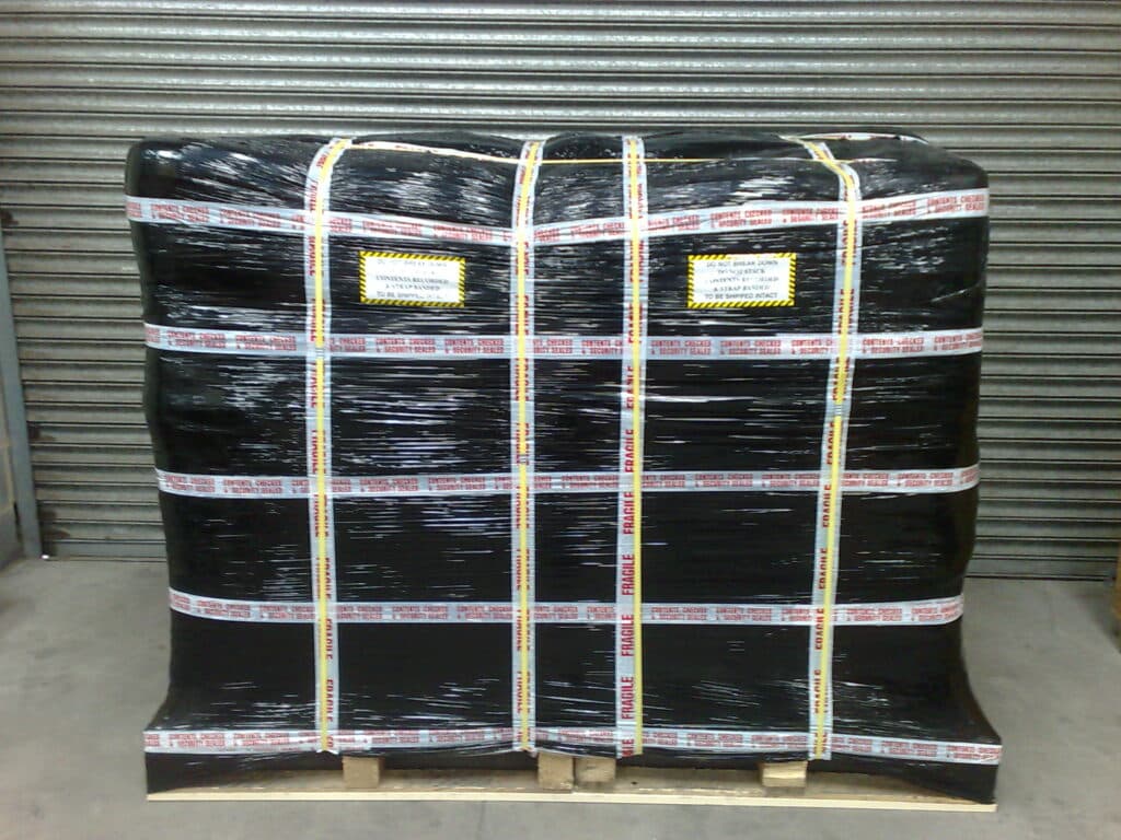shrink-wrapped pallet of personal effects ready for the next stage of packing for international removals