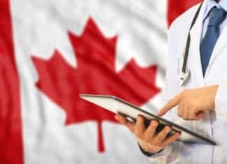 Doctor on Canada flag background - Canadian Healthcare