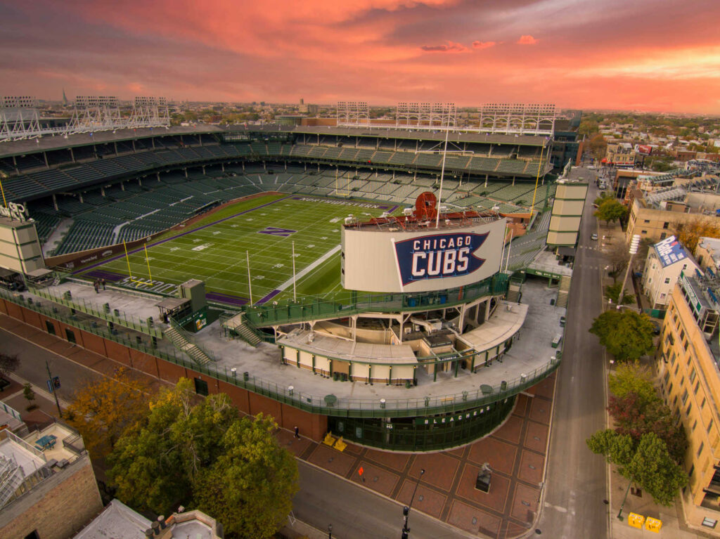 Aerial view of Wrigley Field at sunset, home of the Chicago Cubs, highlighting one of the city’s most iconic attractions.