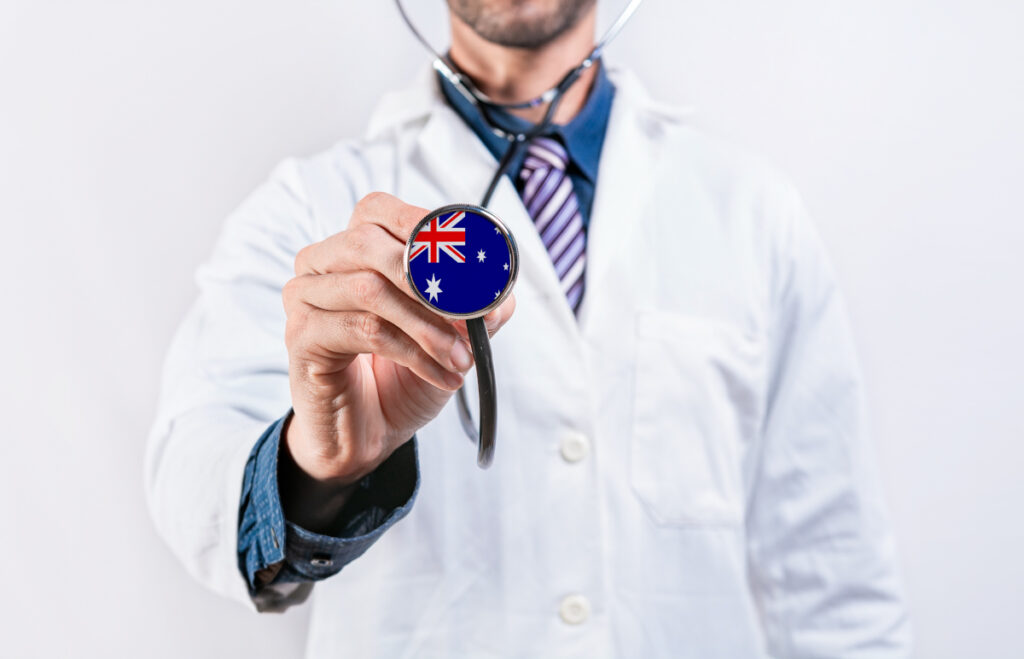 Australia healthcare system, doctor holding stethoscope. Australia health and medical insurance concept