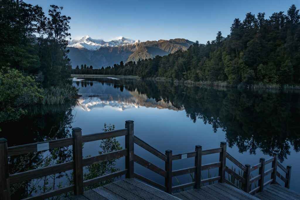 View of Mt Cook from Lake Matheson, West Coast, New Zealand - source: unsplash - Living in The 16 Regions of New Zealand