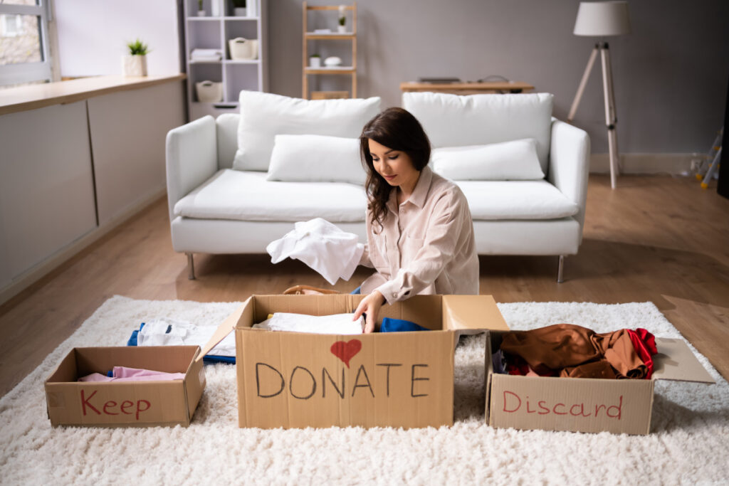 Donating Decluttering And Cleaning Up Clothes - tips to save money when moving overseas