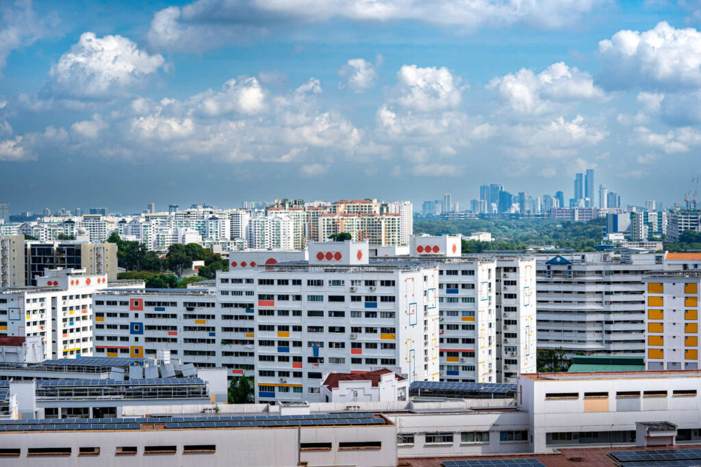 High-rise public housing apartments in Singapore with a view of the city skyline, illustrating typical residential areas and urban living.
