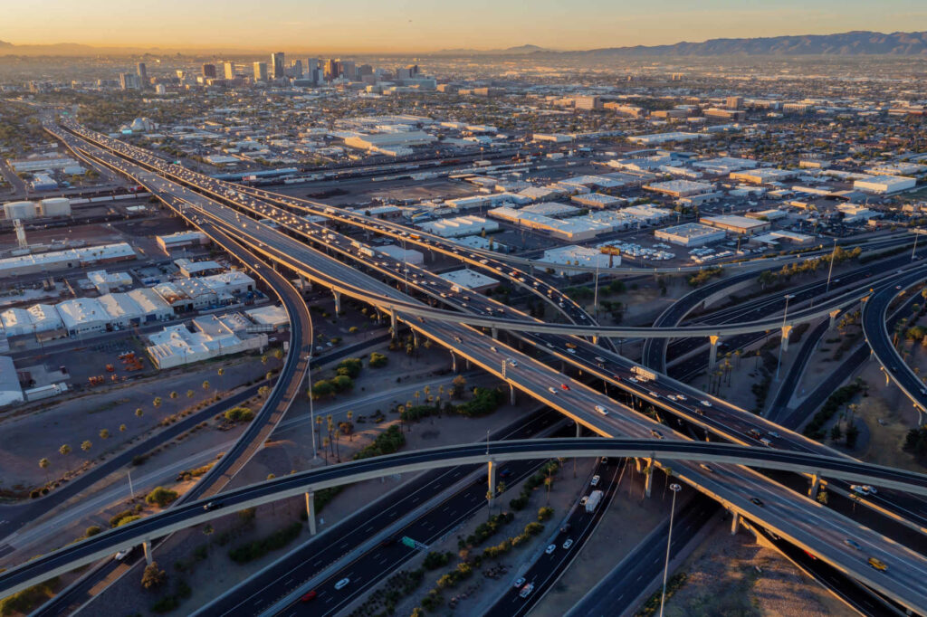 Interstate Freeway junction and rush hour traffic at sunrise, Maryvale, Phoenix.