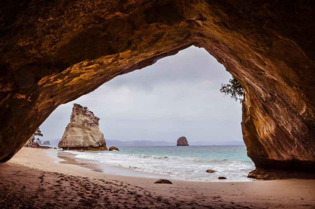 Cathedral Cove, Te Whanganui-A-Hei Marine Reserve, New Zealand - source: unsplash - Living in The 16 Regions of New Zealand