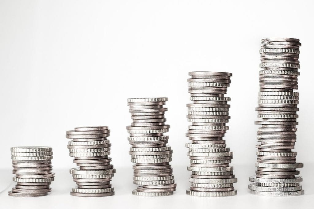 Stacks of coins - pros and cons of living abroad