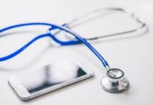 Image of a stethoscope and mobile phone - healthcare in Dubai for expats