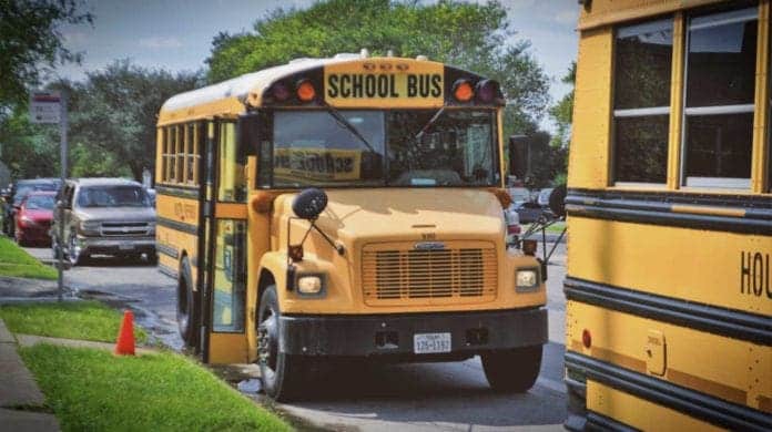 usa-school-buses-2801134 American Yellow School Bus parked at sidewalk