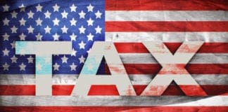 tax printed on the stars and stripes flag
