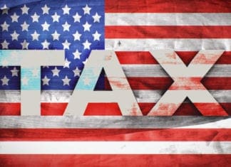 tax printed on the stars and stripes flag